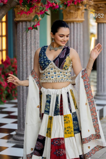 Multi ColorPatchworkSilkBlouseFeaturingSeashellFringeDetailingPairedwithMatchingLehenga Close UpOutdoorPortrait