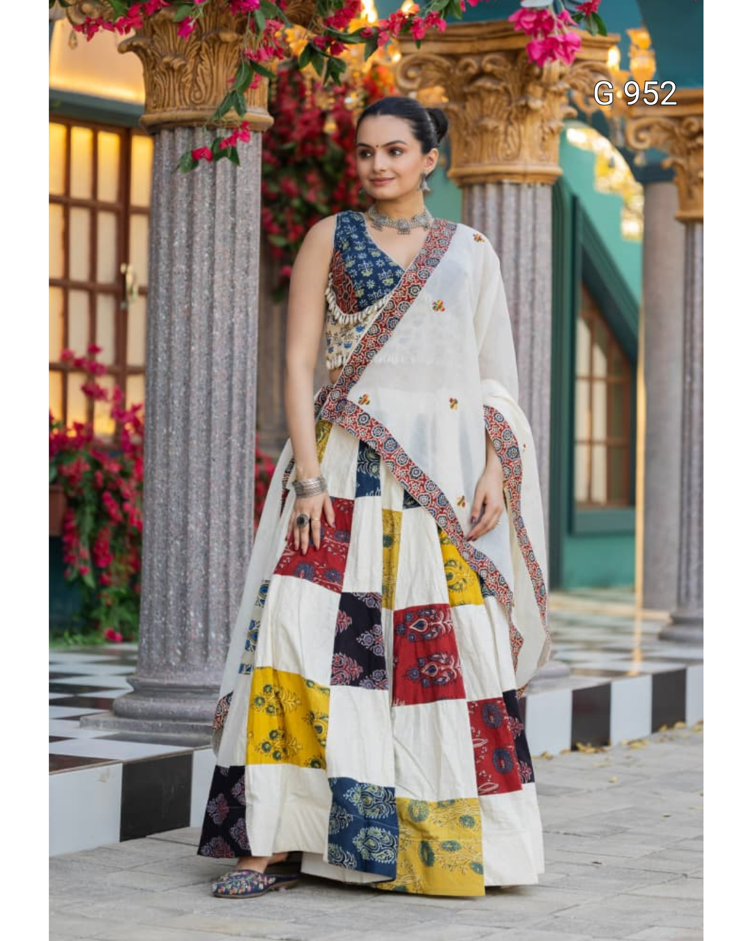 Navratri Ajrakh Hand Block Print Stitched Lehenga choli Set | Pure Khadi Cotton 3 Off WhiteandMulti ColorPatchworkPrintLehengaSetwithMulticoloredPrintedBlouseandDupatta StandingOutdoorColumnPose